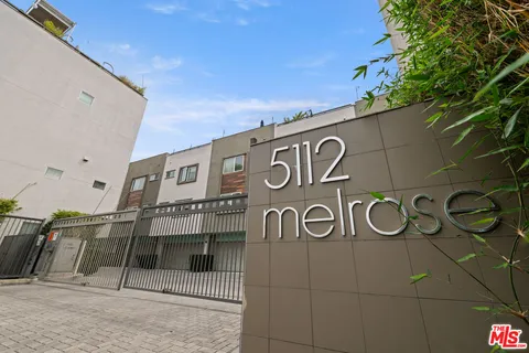 a bed room with a bed and a window