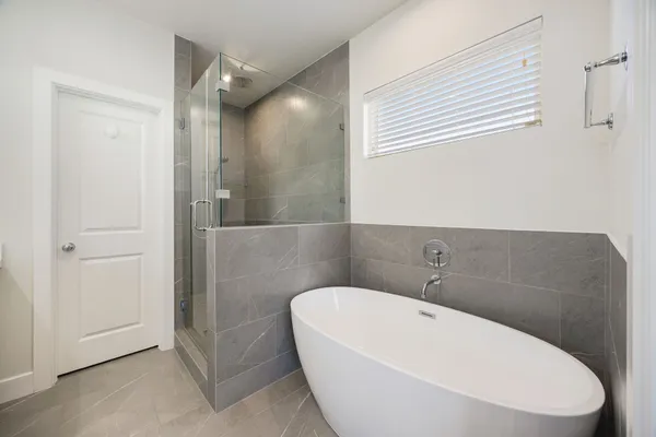 a white bath tub sitting in a bathroom