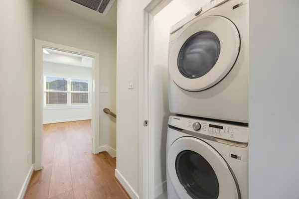 a view of a hallway with washer and dryer