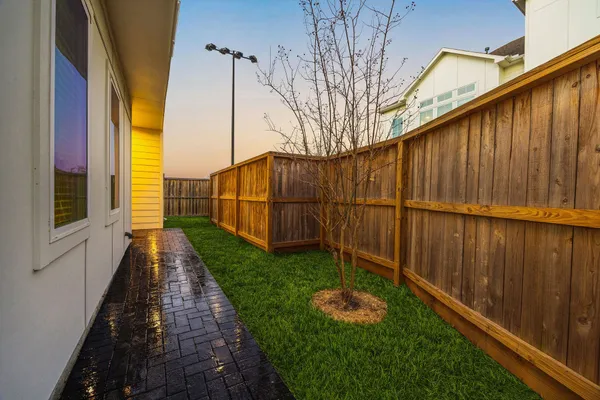 a backyard of a house with lots of green space