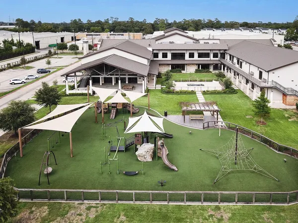 an aerial view of a house with a garden