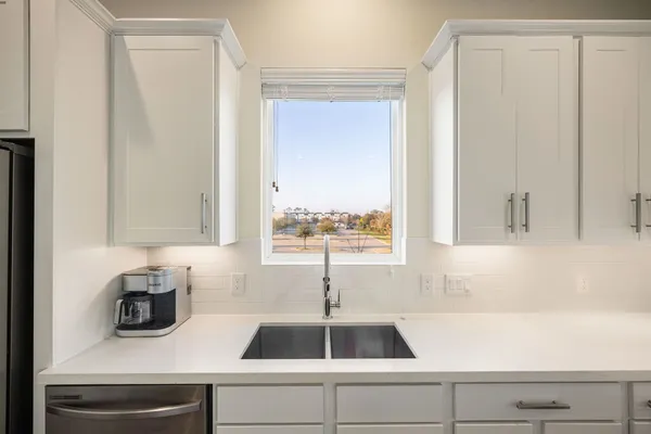 a kitchen with a sink and a window
