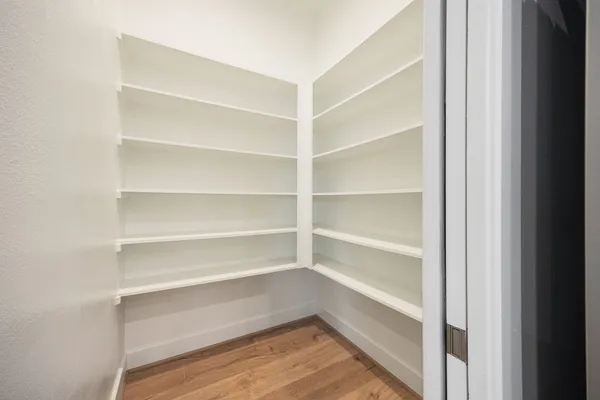 a storage room with wooden floor