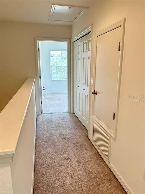 7006 Spotted Deer Place Riverview, FL 33578 - Photo 17 of 21 a view of a hallway view with wooden floor and staircase