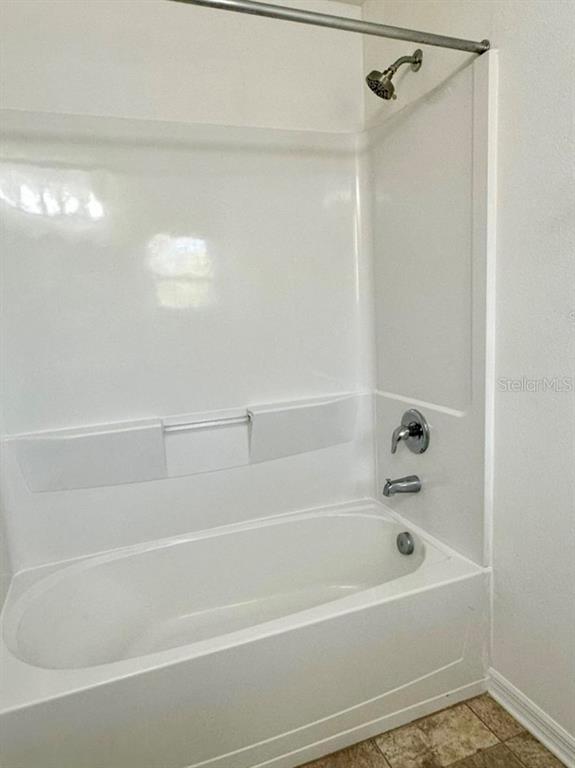 7006 Spotted Deer Place Riverview, FL 33578 - Photo 18 of 21 a bathroom with a bathtub