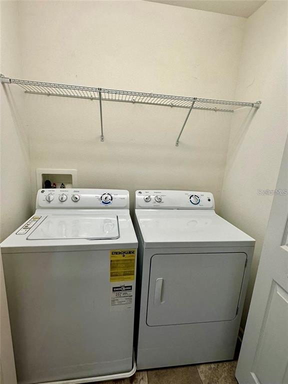 7006 Spotted Deer Place Riverview, FL 33578 - Photo 19 of 21 a utility room with dryer and washer
