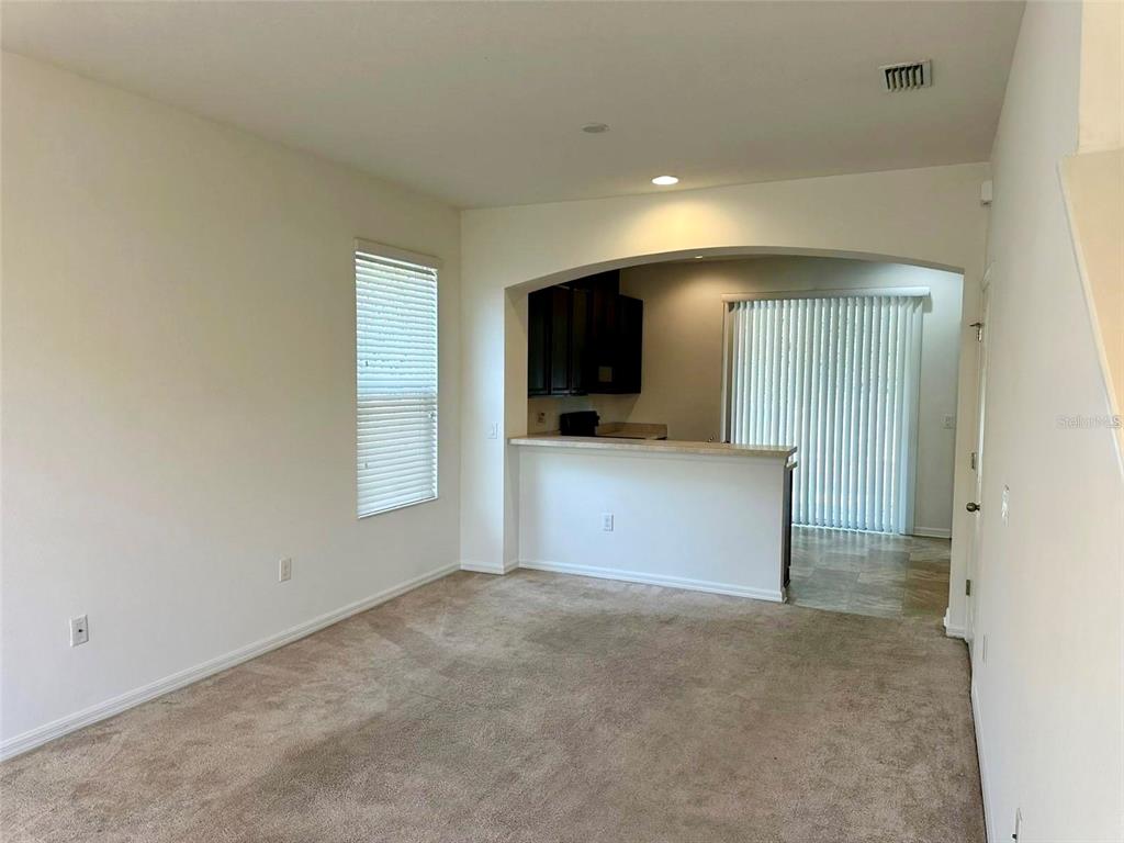 7006 Spotted Deer Place Riverview, FL 33578 - Photo 6 of 21 a view of a kitchen with a sink and a television