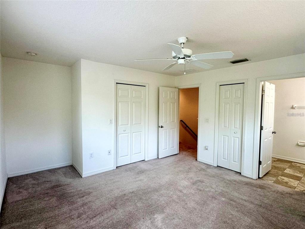 7006 Spotted Deer Place Riverview, FL 33578 - Photo 10 of 21 an empty room with closet and a ceiling fan
