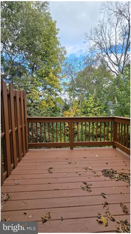 a view of wooden fence and trees