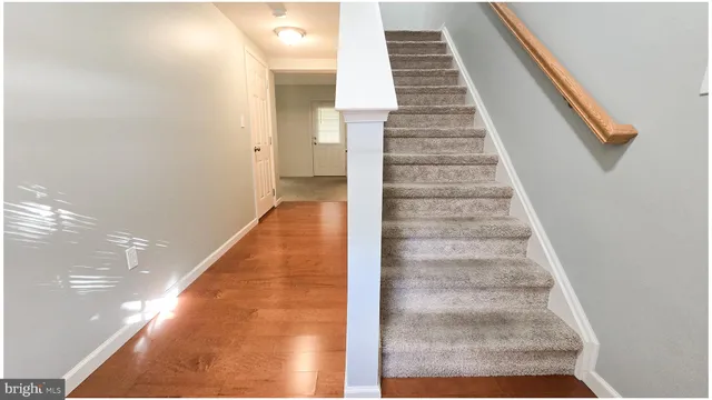 a view of staircase with white walls