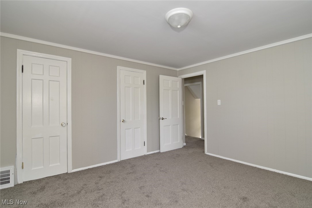 1443 Churchill Road Lyndhurst, OH 44124 - Photo 34 of 39 Unfurnished bedroom featuring ornamental molding and carpet