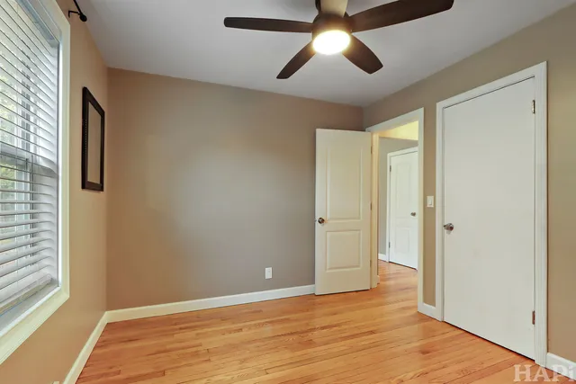 a view of an empty room and wooden floor