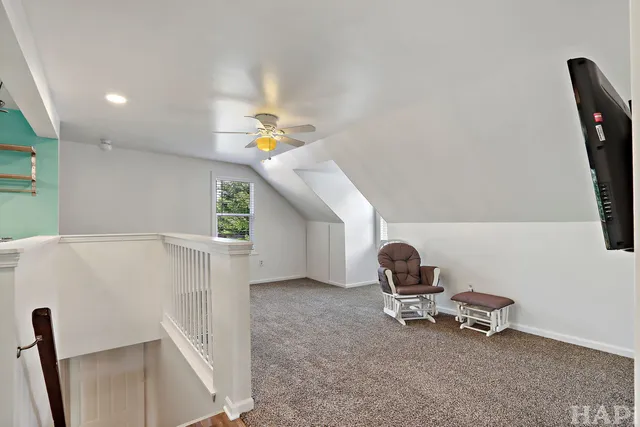 a room with stairs and a wooden floor