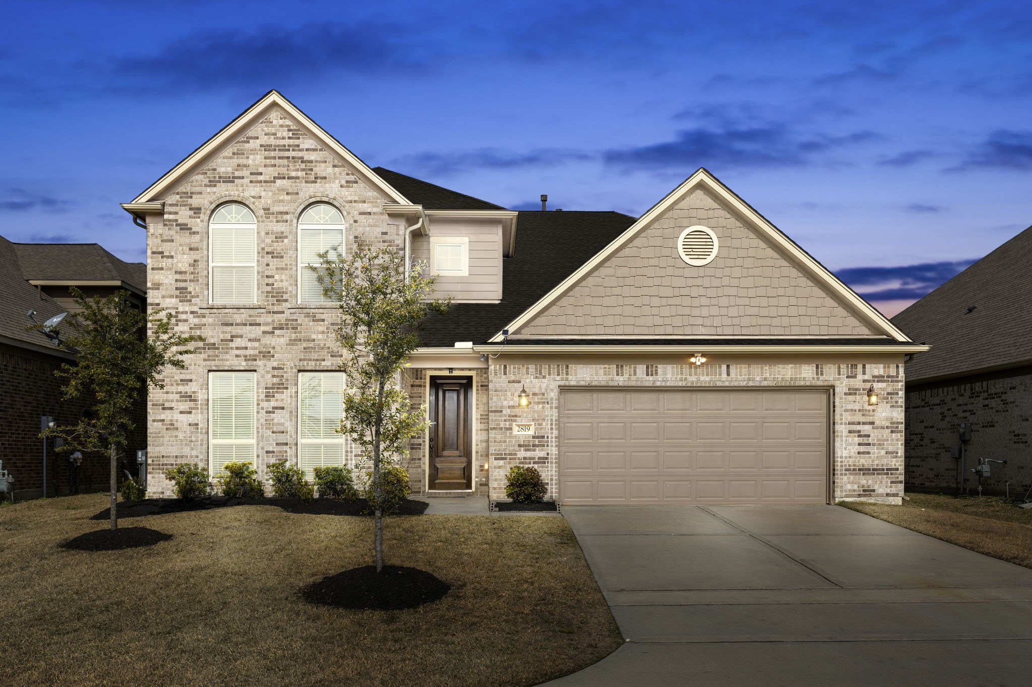 2819 Bradbury Hills Road Spring, TX 77373 - Photo 2 of 50 Experience the charm of this elegant brick home at twilight, featuring a welcoming facade and serene suburban ambiance.