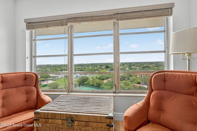 a bed room with a bed and a television