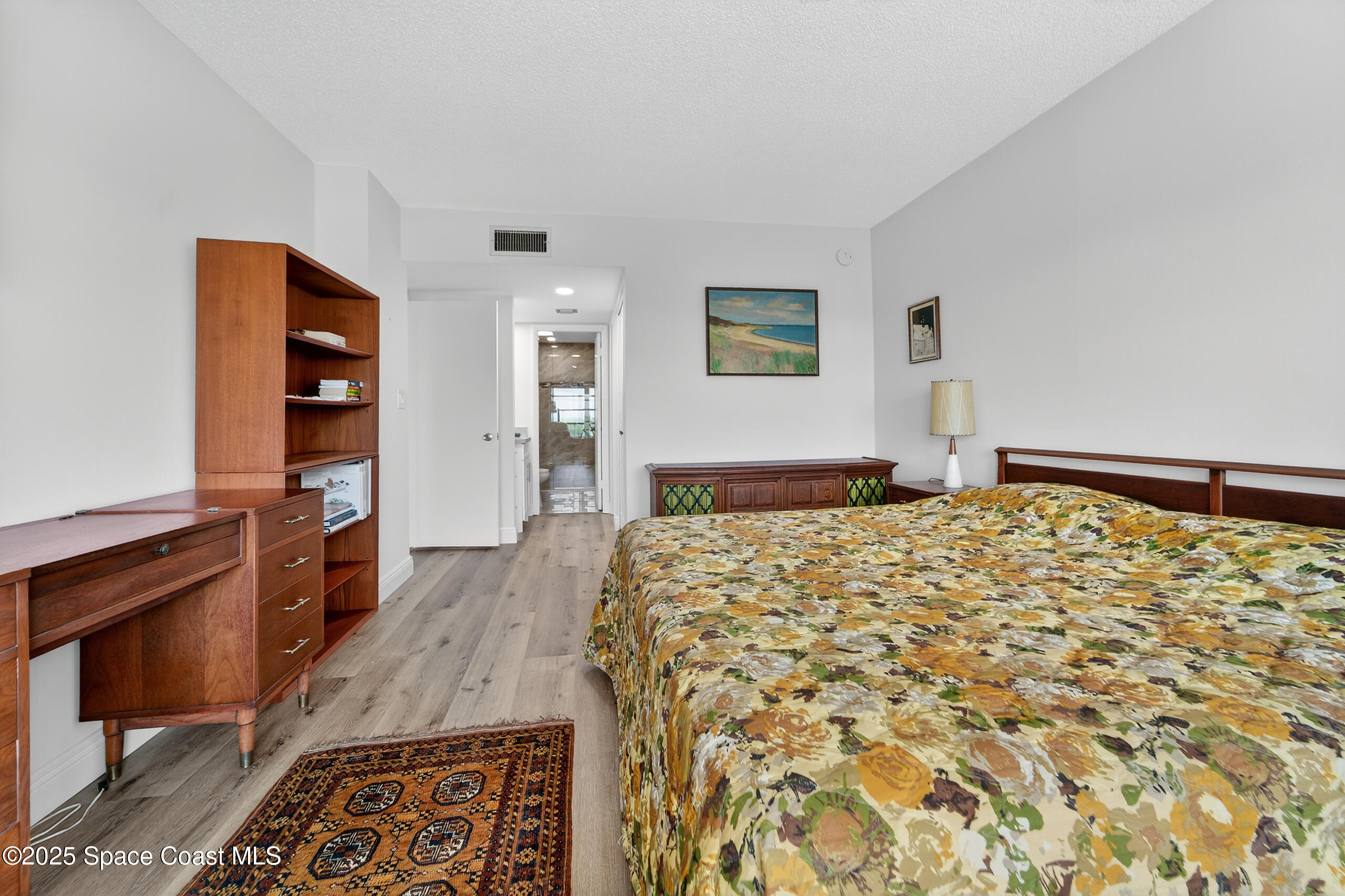 10777 West Sample Road, Unit 1212 Coral Springs, FL 33065 - Photo 17 of 41 a bed room with a bed and a television
