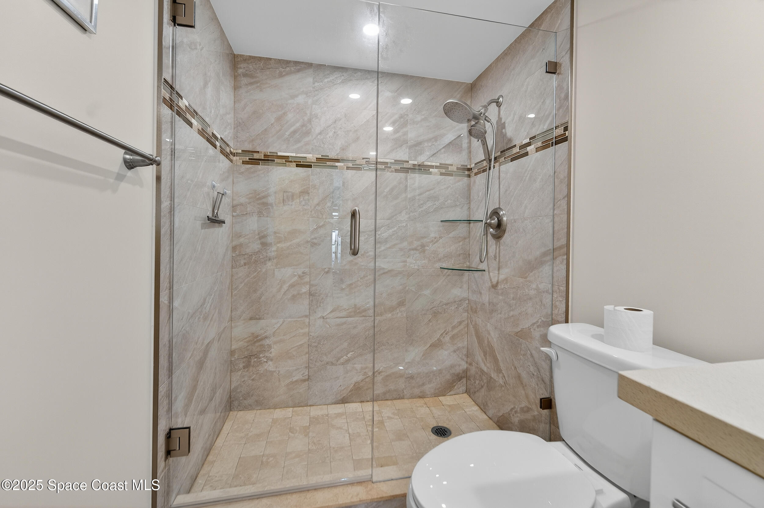 10777 West Sample Road, Unit 1212 Coral Springs, FL 33065 - Photo 18 of 41 a bathroom with a toilet and a shower
