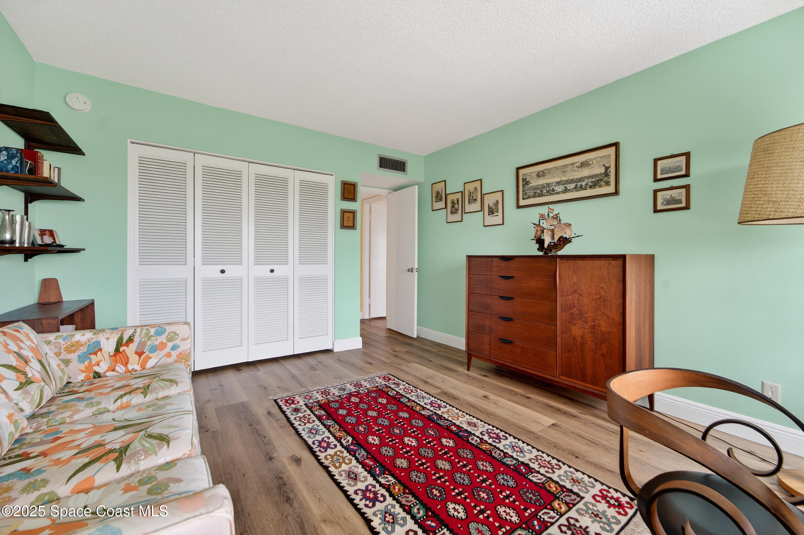 10777 West Sample Road, Unit 1212 Coral Springs, FL 33065 - Photo 21 of 41 a living room with furniture and wooden floor