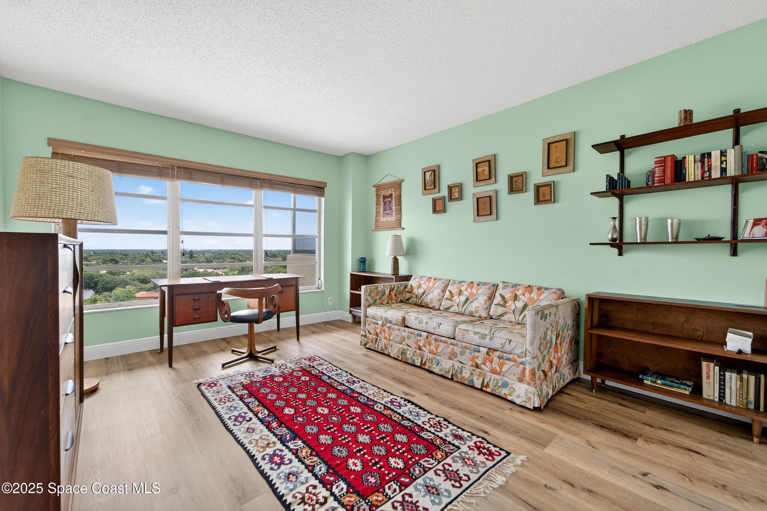 10777 West Sample Road, Unit 1212 Coral Springs, FL 33065 - Photo 23 of 41 a living room with furniture and a window