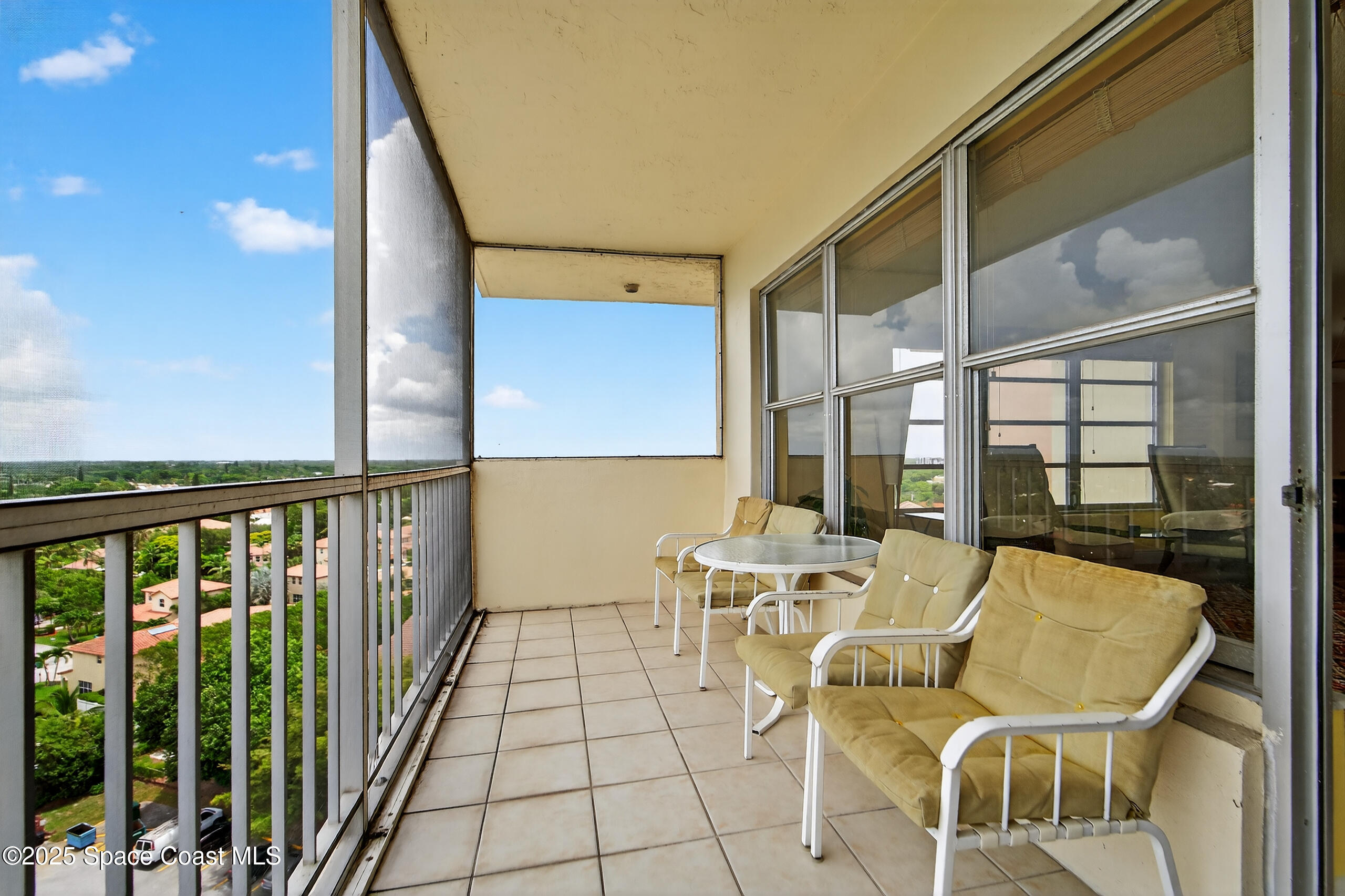 10777 West Sample Road, Unit 1212 Coral Springs, FL 33065 - Photo 6 of 41 a view of a balcony with chairs