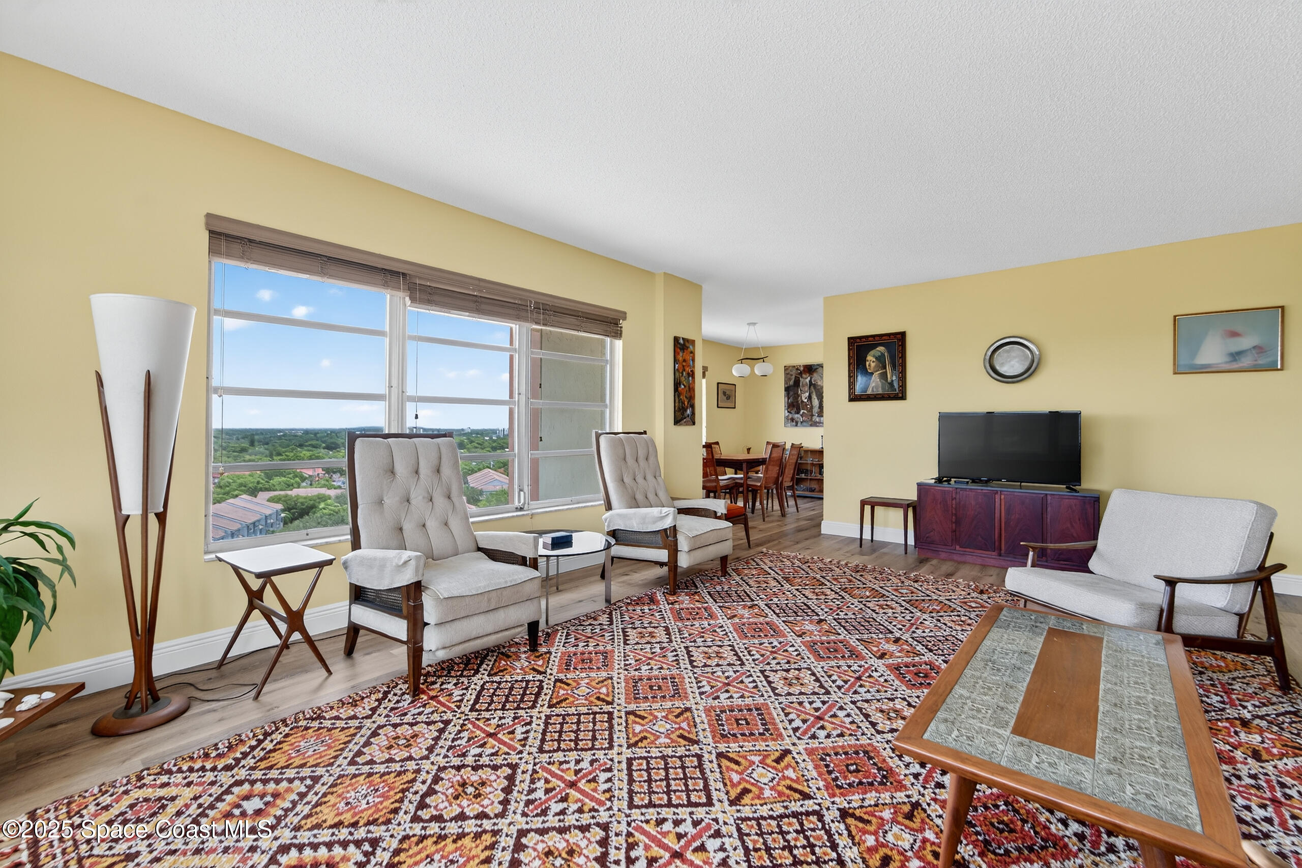 10777 West Sample Road, Unit 1212 Coral Springs, FL 33065 - Photo 8 of 41 a living room with furniture and a large window