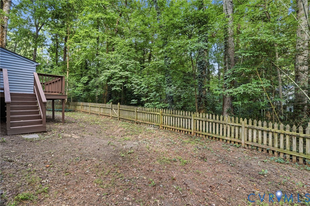 13913 Barnes Spring Road Midlothian, VA 23112 - Photo 39 of 51 Backyard featuring a privacy fence, private wooded