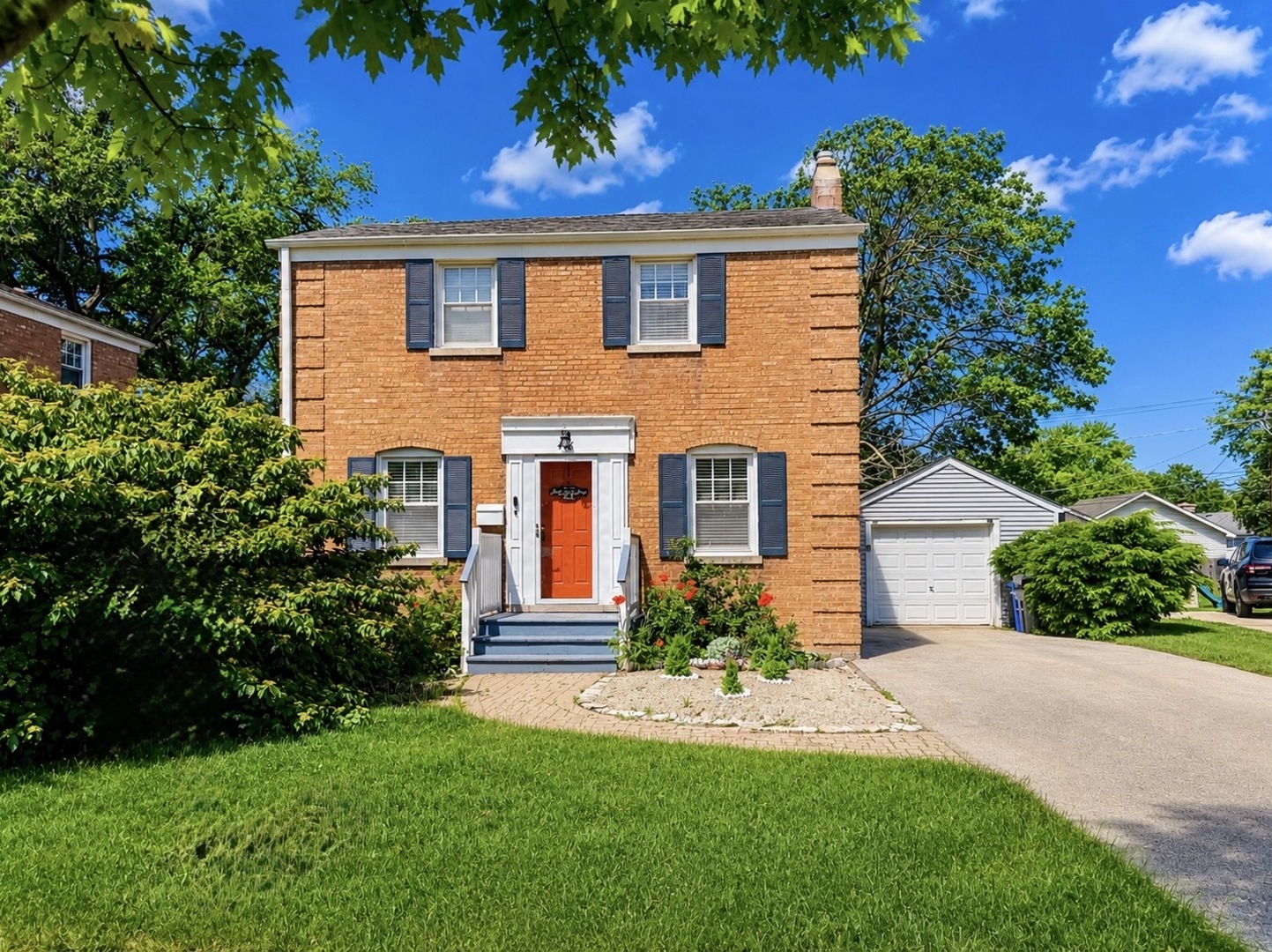 416 North Main Street Mount Prospect, IL 60056 - Photo 1 of 24 a front view of a house with a yard