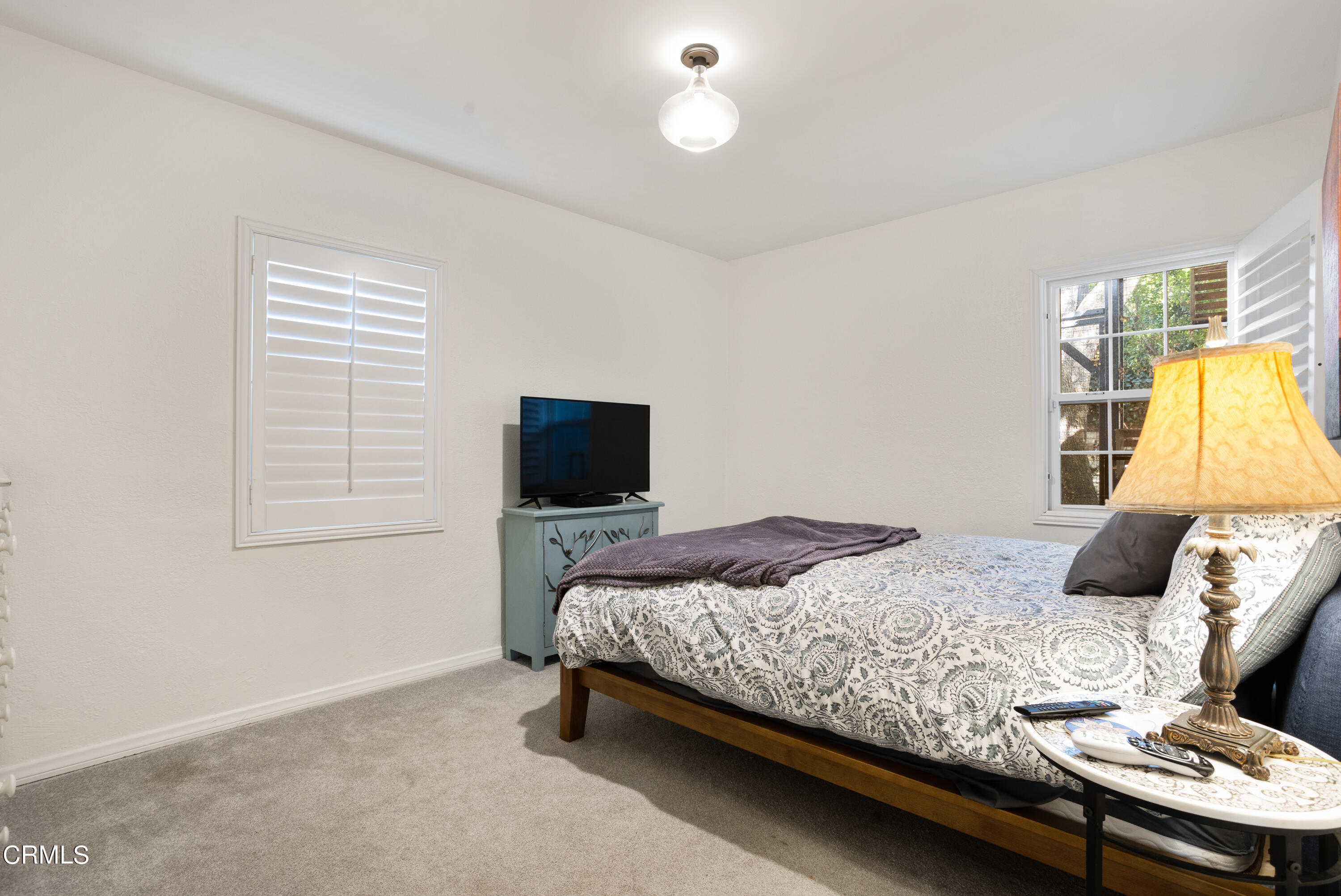 223 Marathon Road Altadena, CA 91001 - Photo 12 of 18 a bedroom with a bed and a flat screen tv