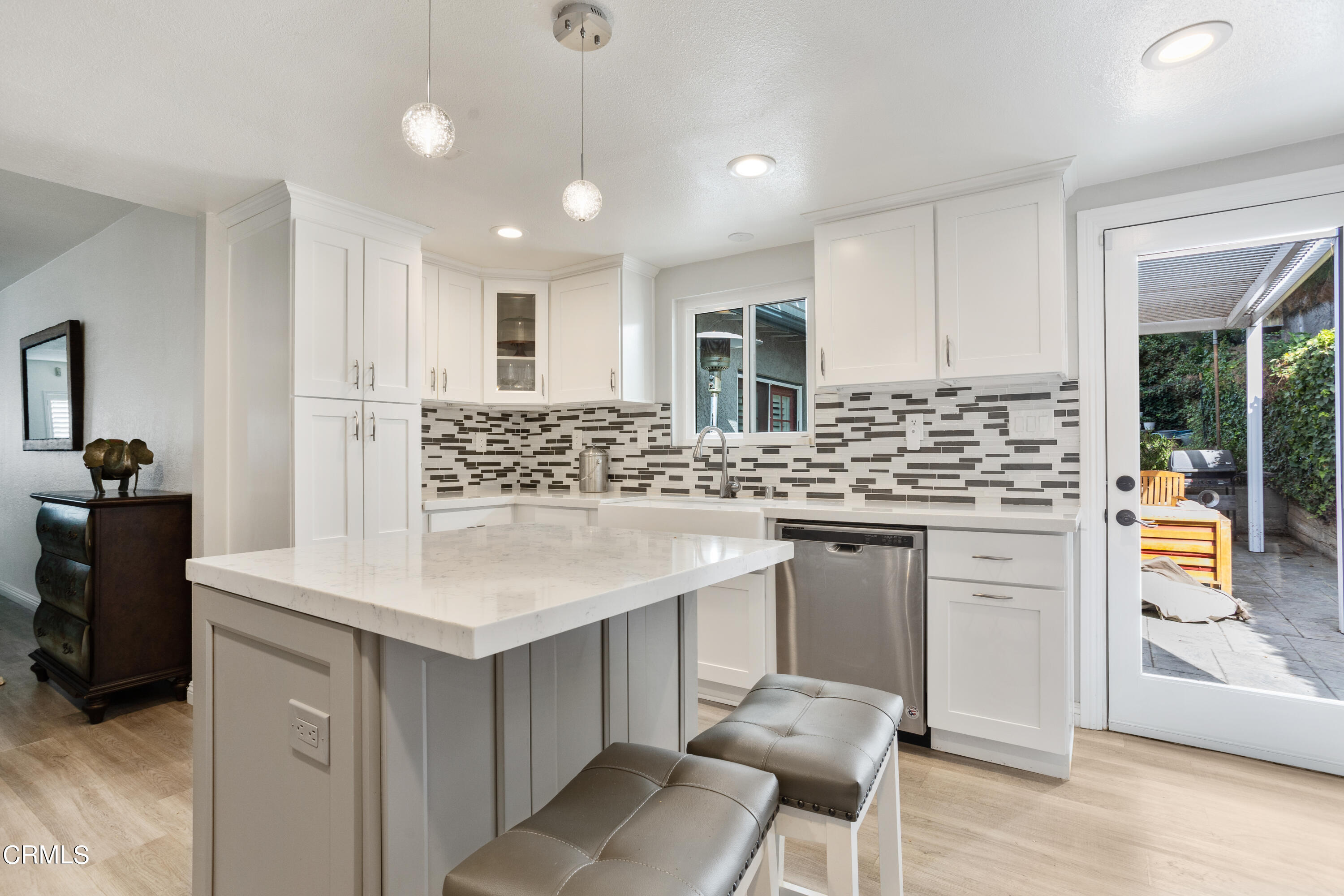 223 Marathon Road Altadena, CA 91001 - Photo 7 of 18 a kitchen with stainless steel appliances kitchen island granite countertop a stove a sink and a refrigerator