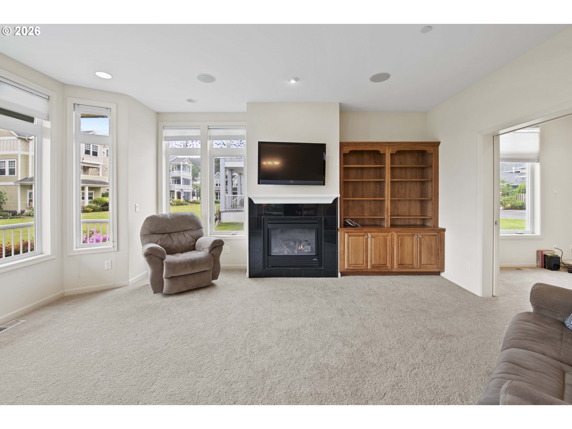 230 Round House Road Astoria, OR 97103 - Photo 6 of 43 a living room with furniture and a flat screen tv