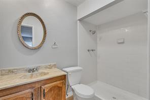 6305 Monahans Court Plano, TX 75023 - Photo 16 of 24 a bathroom with a granite countertop toilet sink and mirror