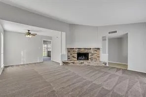 a view of an empty room with a fireplace