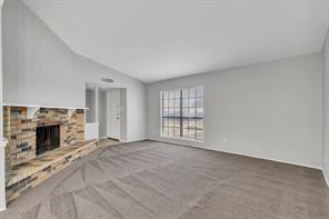 6305 Monahans Court Plano, TX 75023 - Photo 5 of 24 a view of an empty room with a fireplace