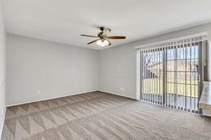 6305 Monahans Court Plano, TX 75023 - Photo 9 of 24 wooden floor in an empty room with a window