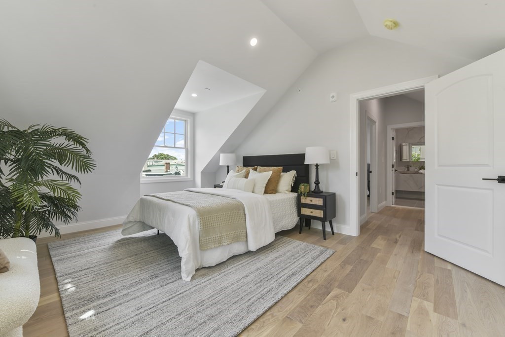137 Falcon Street, Unit 4 Boston, MA 02128 - Photo 12 of 22 a bedroom with a bed and a potted plant