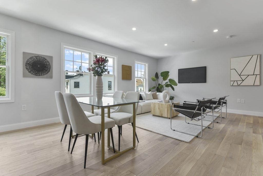 137 Falcon Street, Unit 4 Boston, MA 02128 - Photo 18 of 22 a living room with furniture and a wooden floor