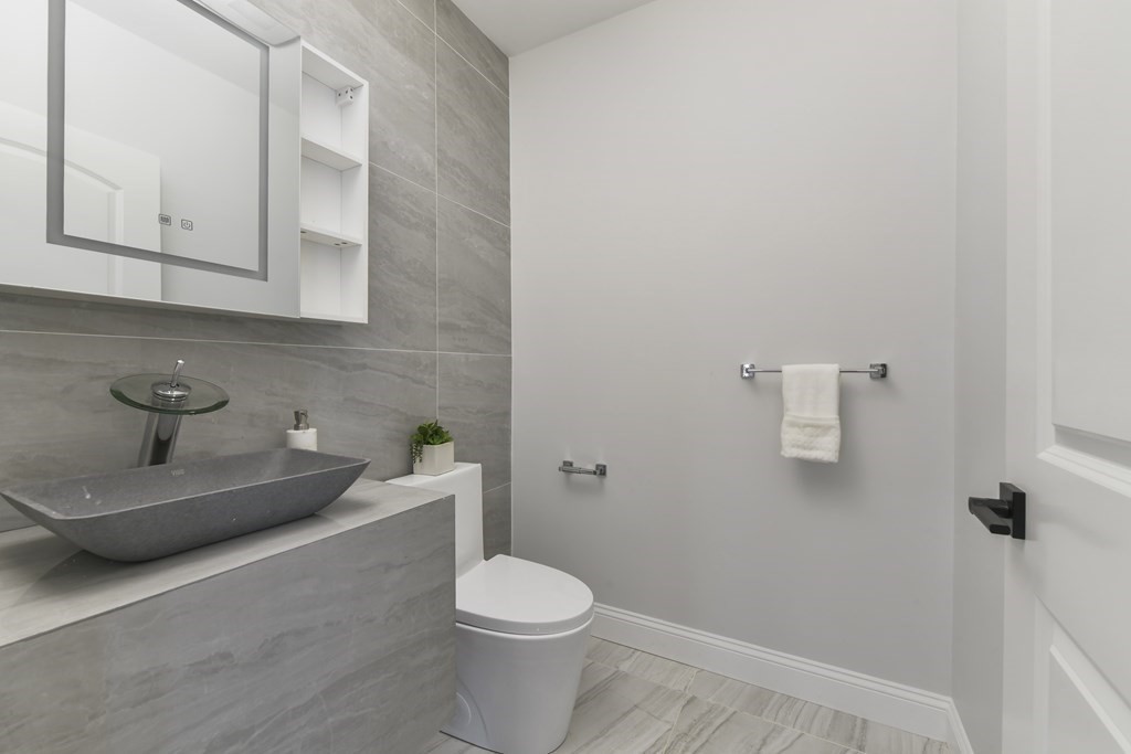 137 Falcon Street, Unit 4 Boston, MA 02128 - Photo 19 of 22 a bathroom with a toilet and a sink
