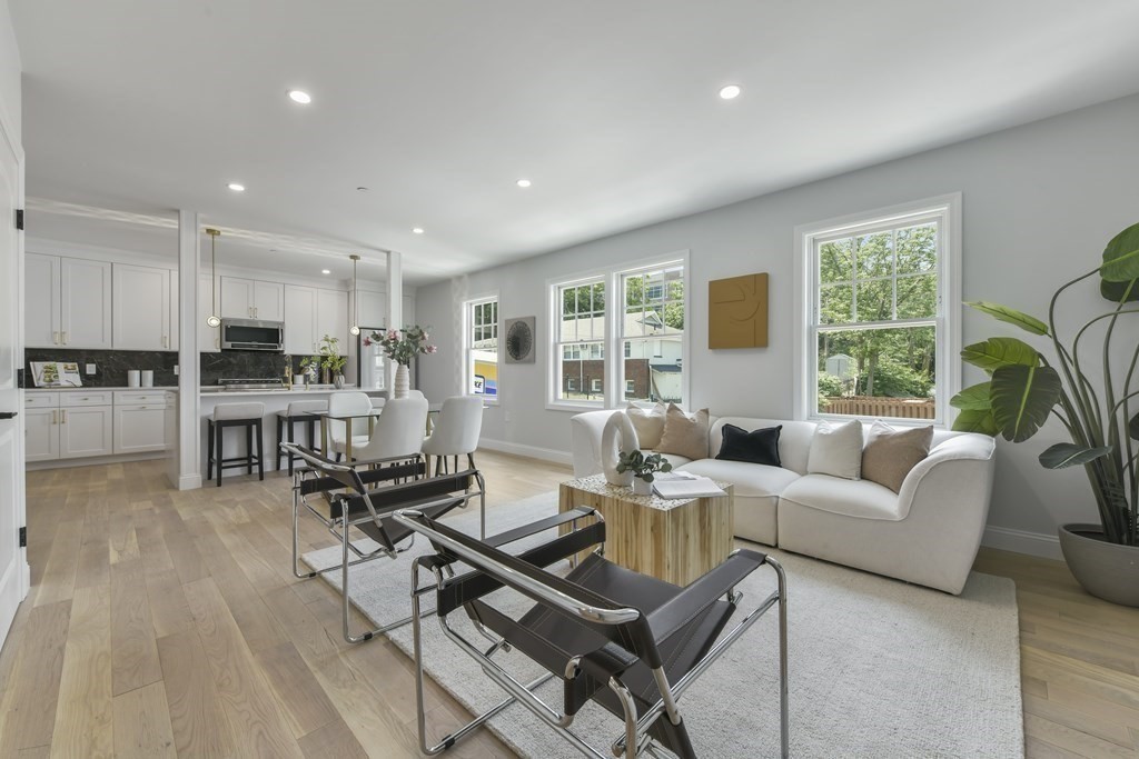 137 Falcon Street, Unit 4 Boston, MA 02128 - Photo 2 of 22 a living room with furniture and a large window
