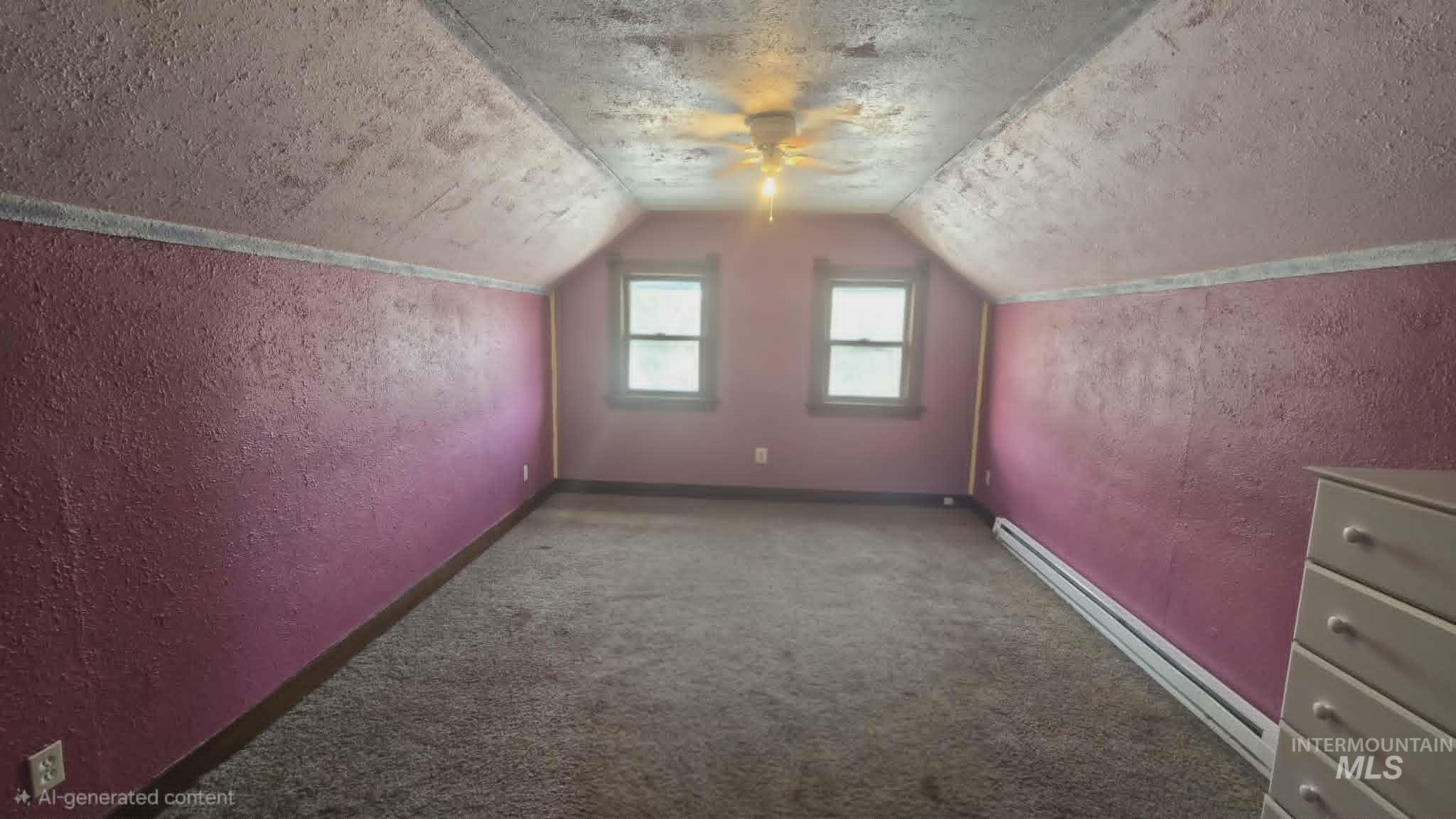 1212 Main Street Pomeroy, WA 99347 - Photo 17 of 18 Carpeted room featuring a sloped ceiling and two casement windows