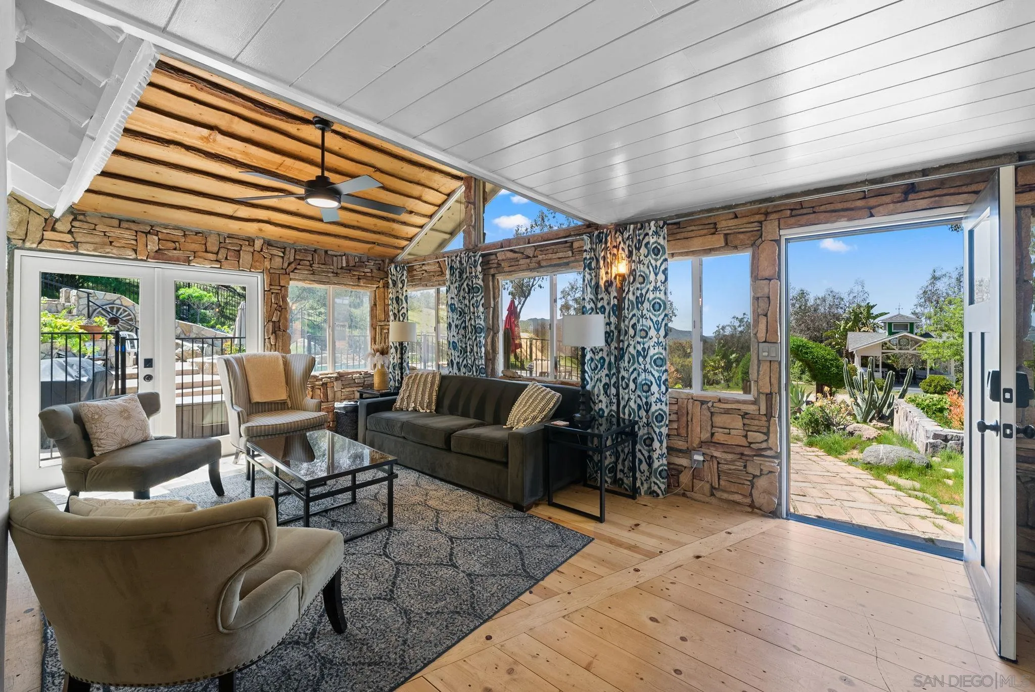 15914 Sequan Truck Trail Alpine, CA 91901 - Photo 12 of 69 a living room with furniture and a patio
