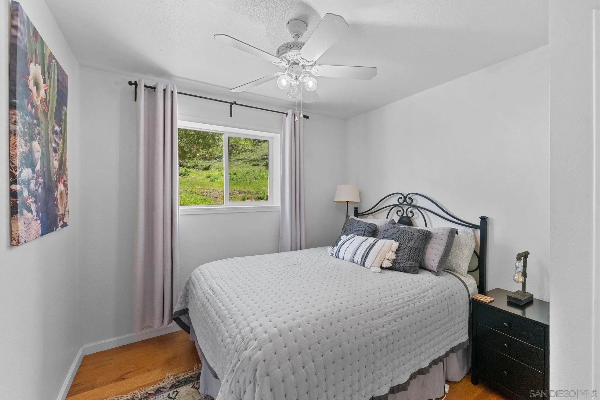 15914 Sequan Truck Trail Alpine, CA 91901 - Photo 19 of 69 a bedroom with a bed and a window