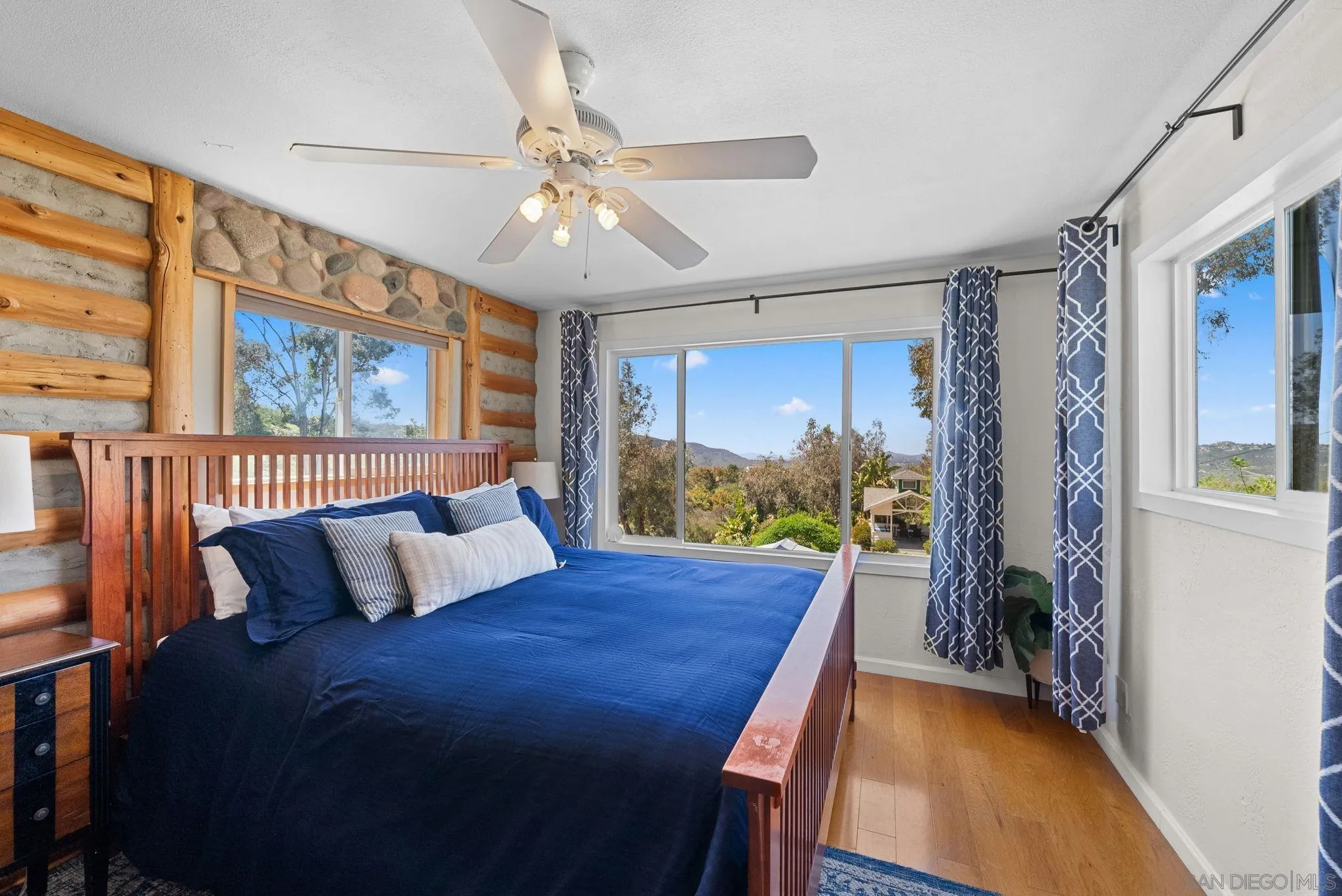 15914 Sequan Truck Trail Alpine, CA 91901 - Photo 22 of 69 a bed room with a bed and a chandelier