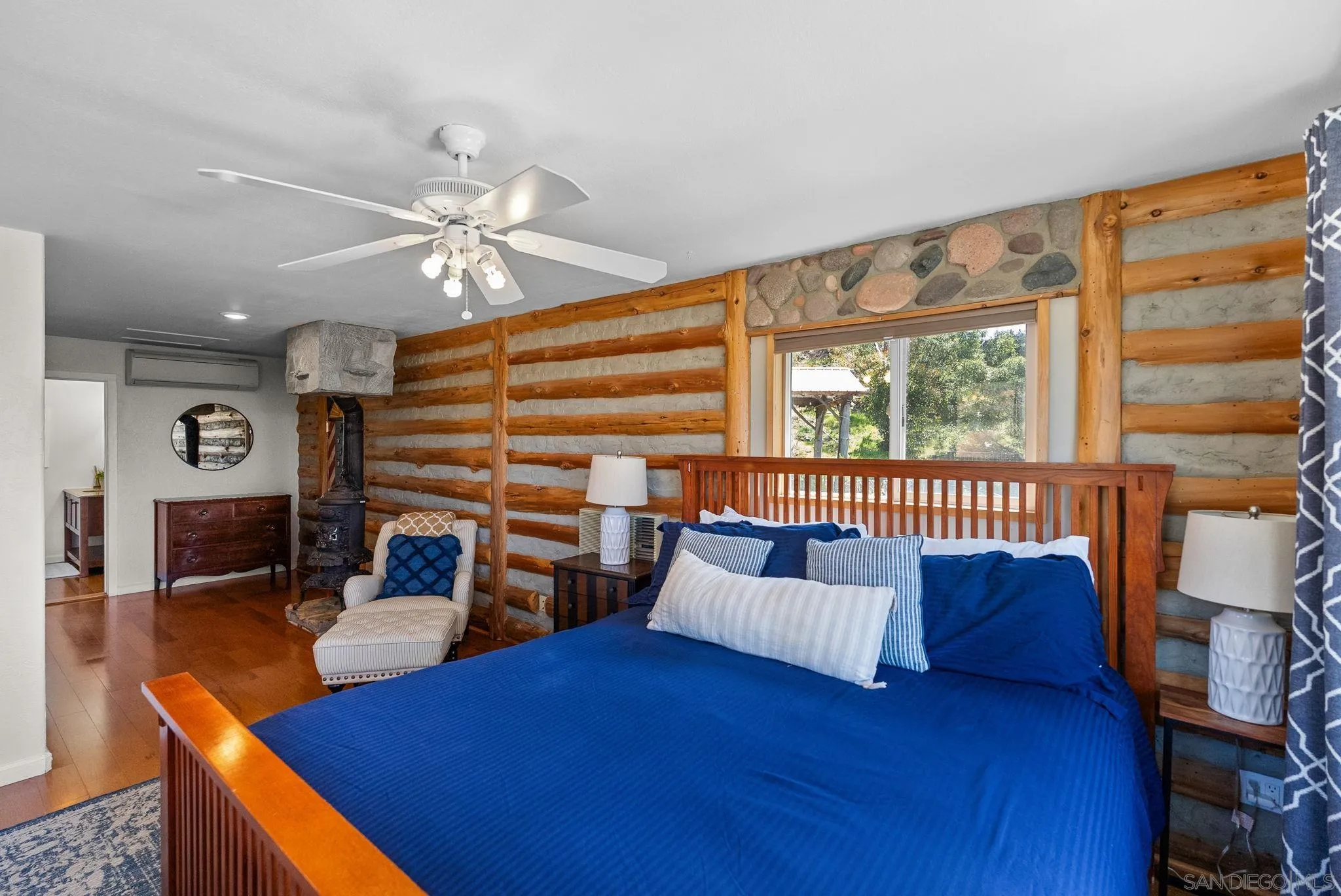 15914 Sequan Truck Trail Alpine, CA 91901 - Photo 24 of 69 a living room with furniture a fireplace and a large window