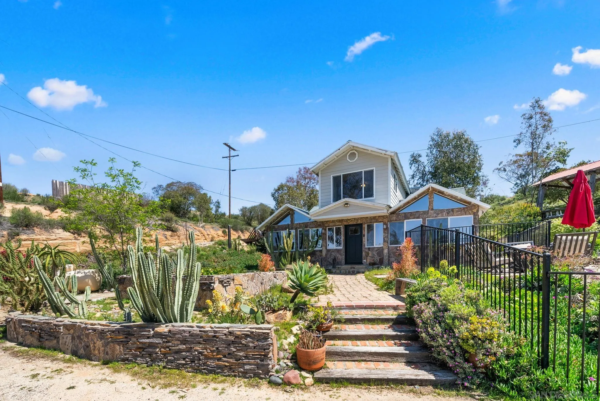 15914 Sequan Truck Trail Alpine, CA 91901 - Photo 27 of 69 a front view of a house with a yard