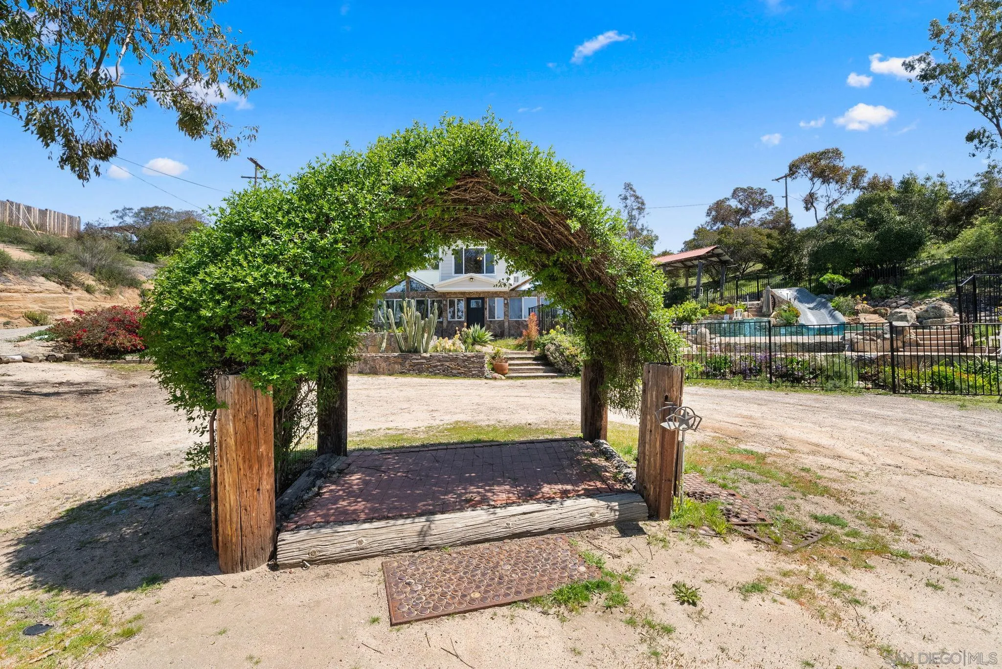 15914 Sequan Truck Trail Alpine, CA 91901 - Photo 32 of 69 a front view of a house with garden