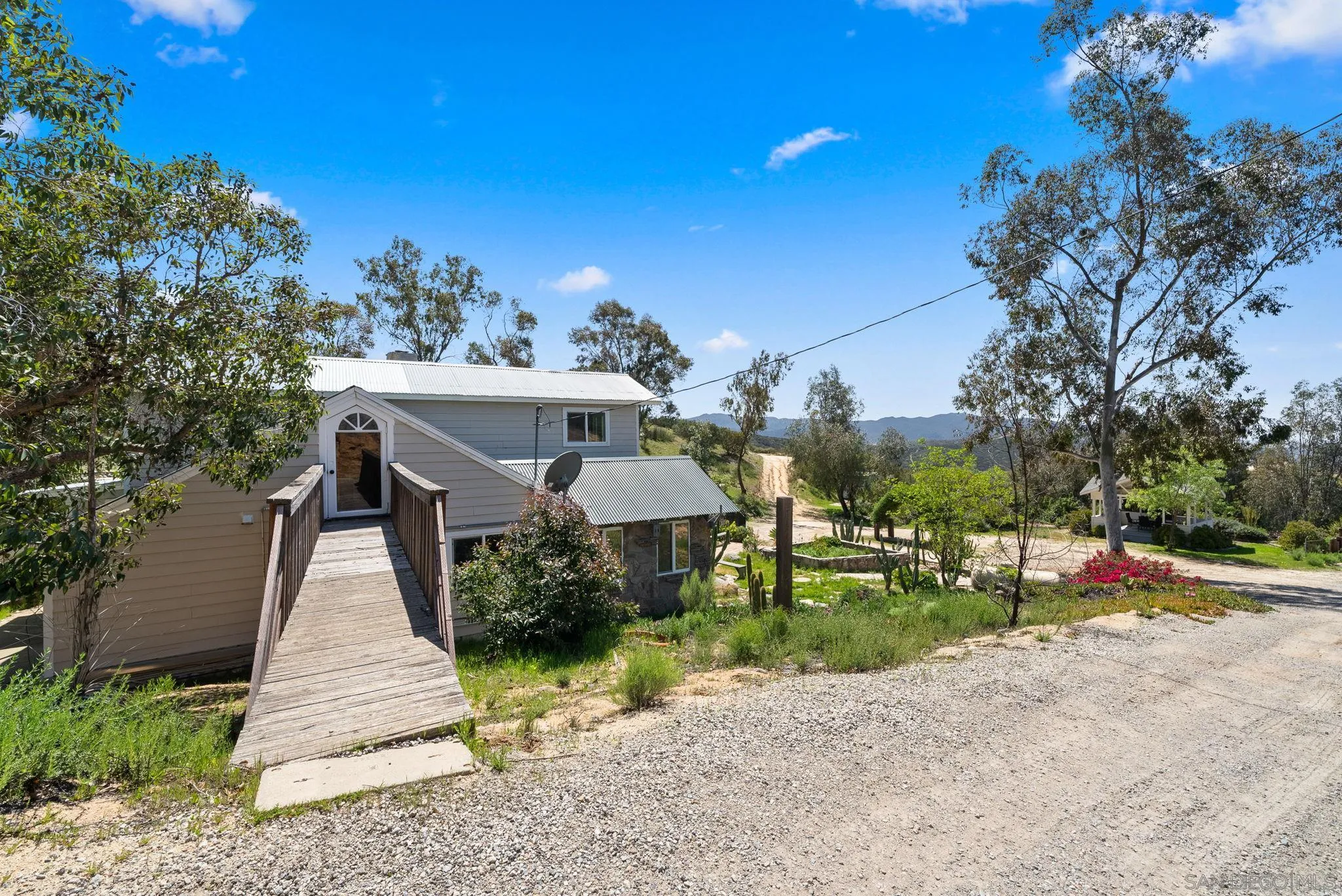15914 Sequan Truck Trail Alpine, CA 91901 - Photo 33 of 69 a front view of a house with a yard