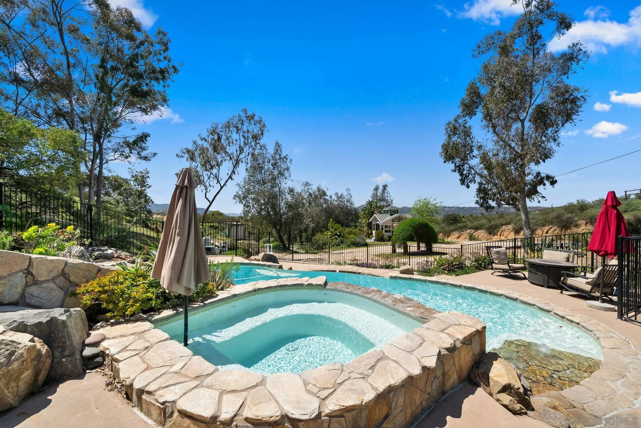 15914 Sequan Truck Trail Alpine, CA 91901 - Photo 40 of 69 a view of a swimming pool with a patio