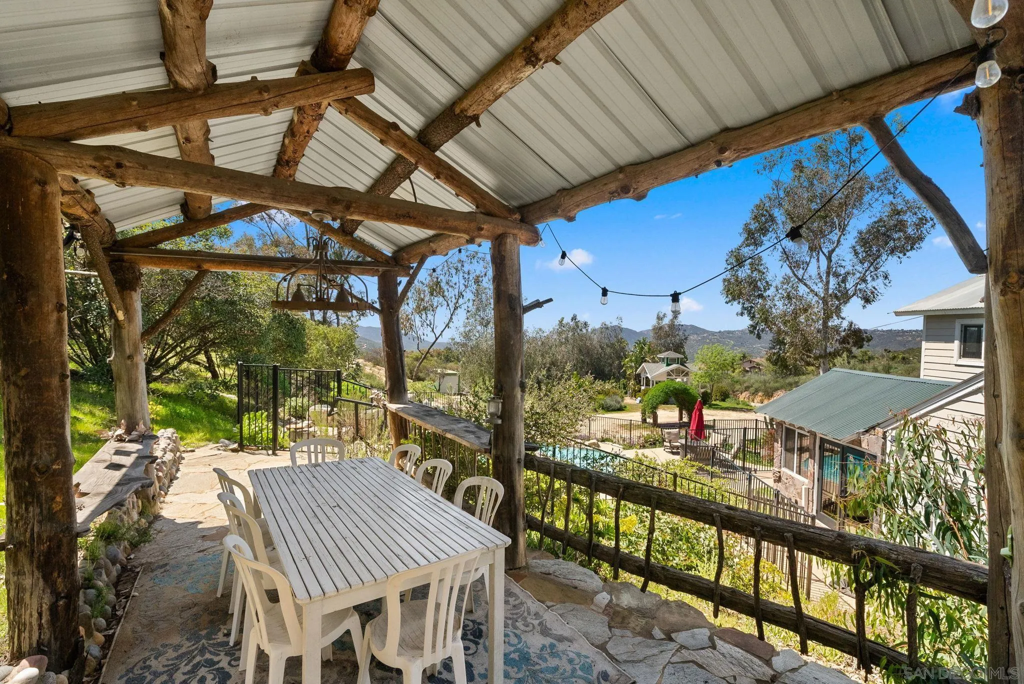 15914 Sequan Truck Trail Alpine, CA 91901 - Photo 43 of 69 a view of a patio with a table and chairs