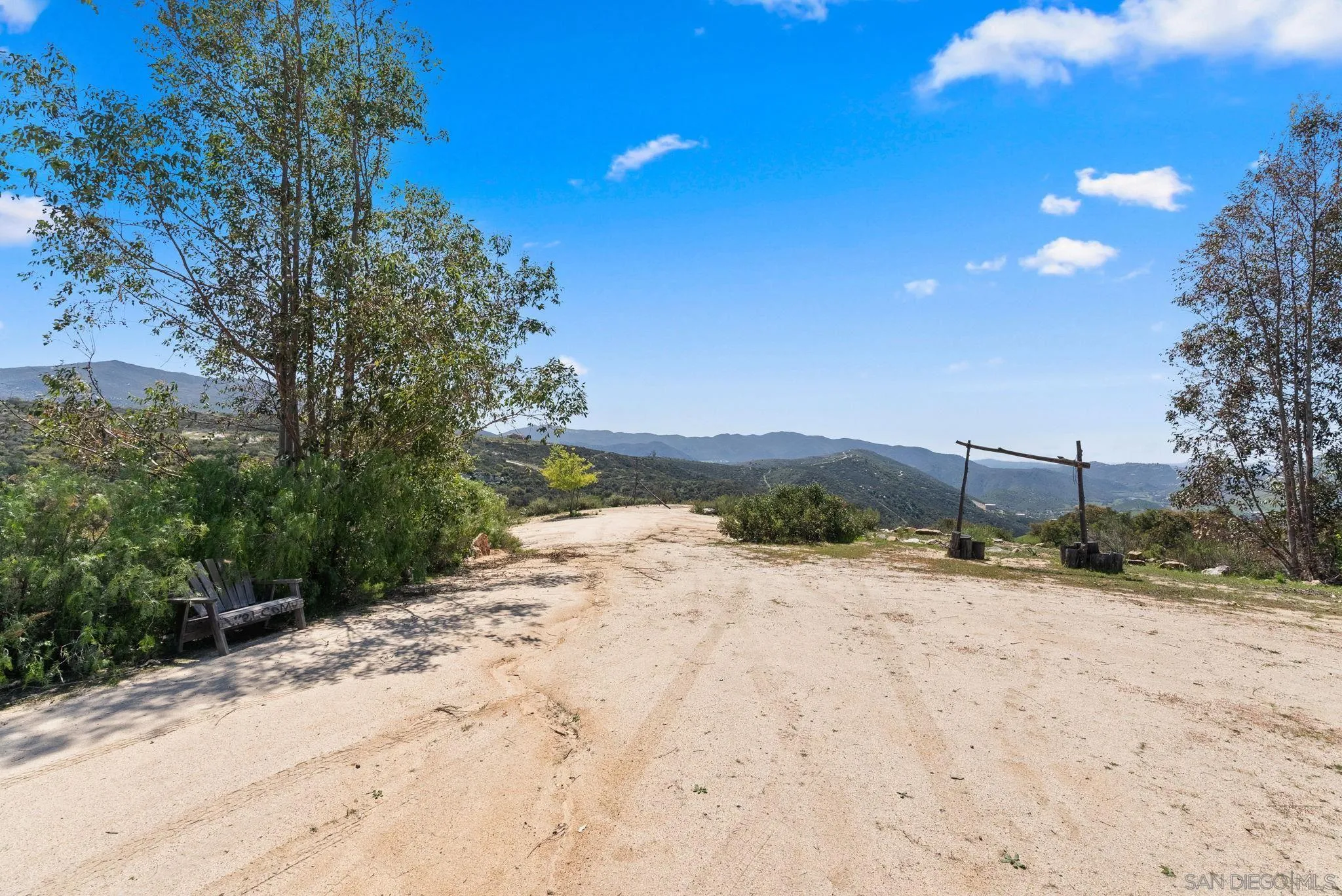 15914 Sequan Truck Trail Alpine, CA 91901 - Photo 47 of 69 a view of a dirt road with a building in the background