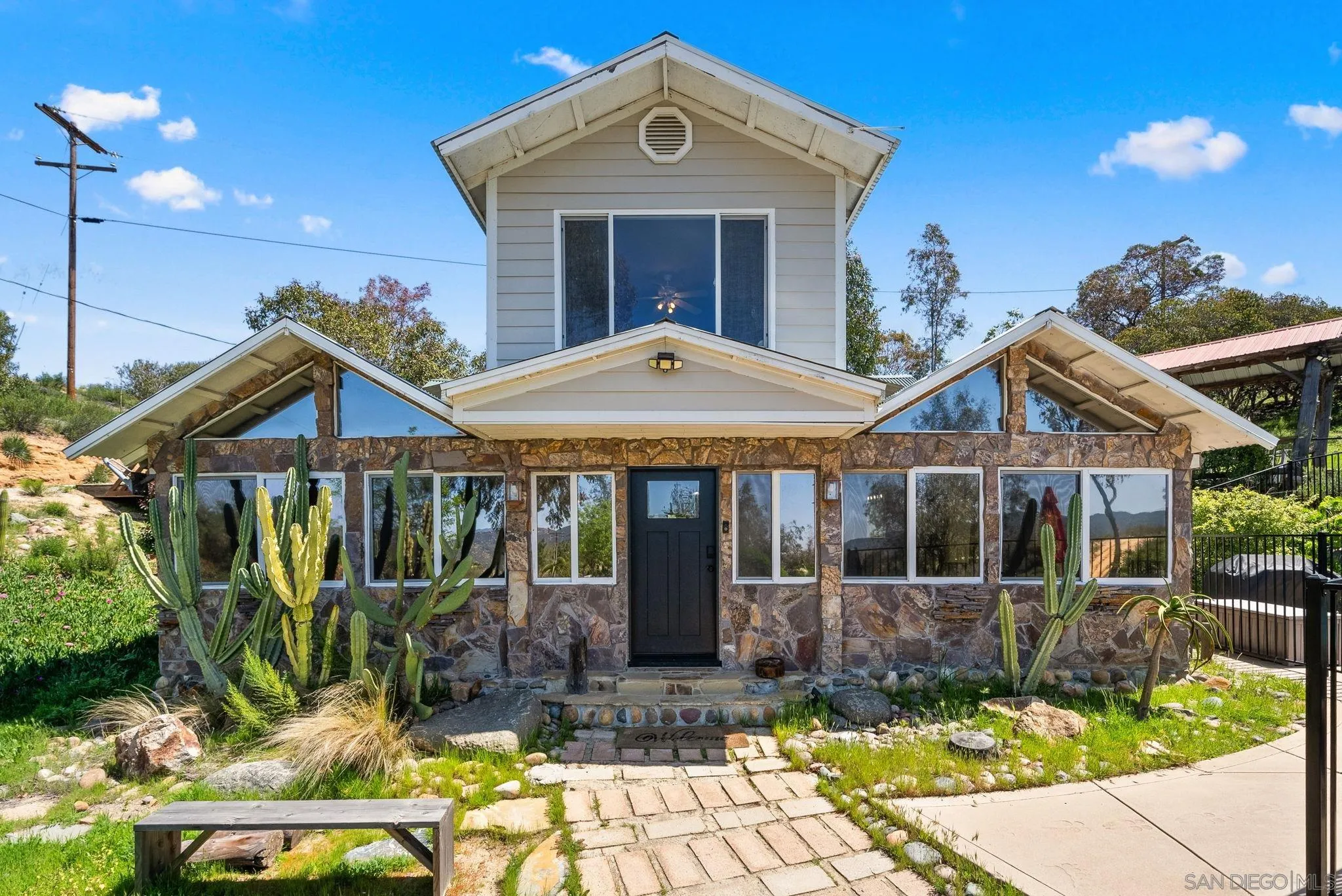 15914 Sequan Truck Trail Alpine, CA 91901 - Photo 6 of 69 a front view of a house with garden